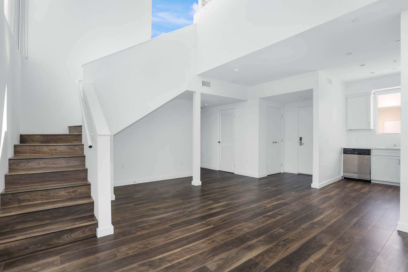 Culver City CA Apartments for Rent - The Lucky - Large Living Area with Hardwood Floors, Large Ceilings, and Stairway to Second Floor